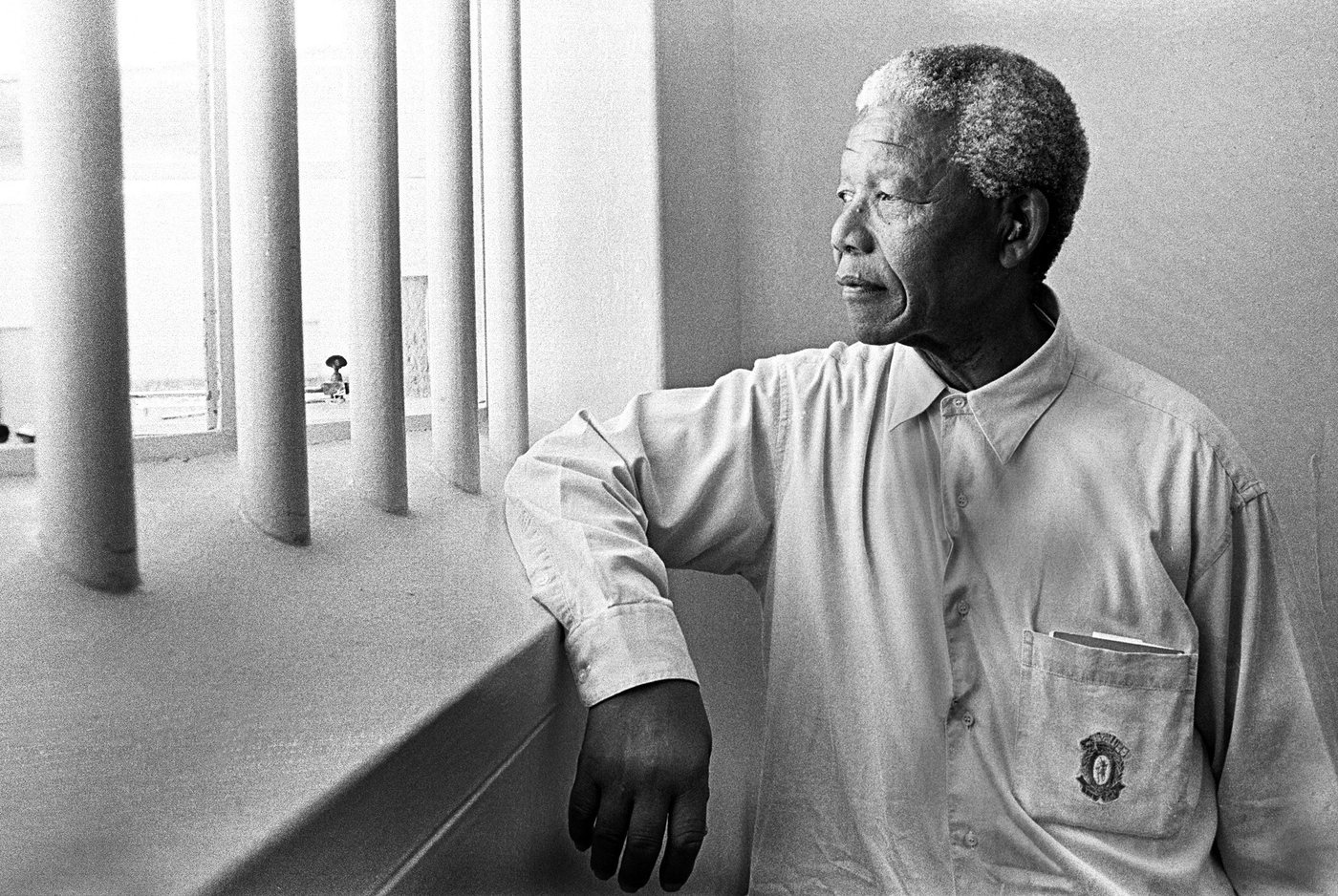 Nelson Mandela at the window of his Robben Island cell